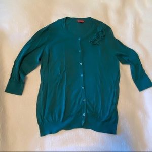 Teal cardigan sweater.